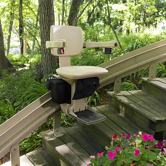 Bruno Elite Outdoor weather-resistant stairlift installed on exterior garden steps, with rust-resistant coating and outdoor-rated components